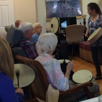 An adult may seem lost in their own world, but when I hand them an instrument and start singing a familiar song, they are able to come out for a while and be in the moment with the group.